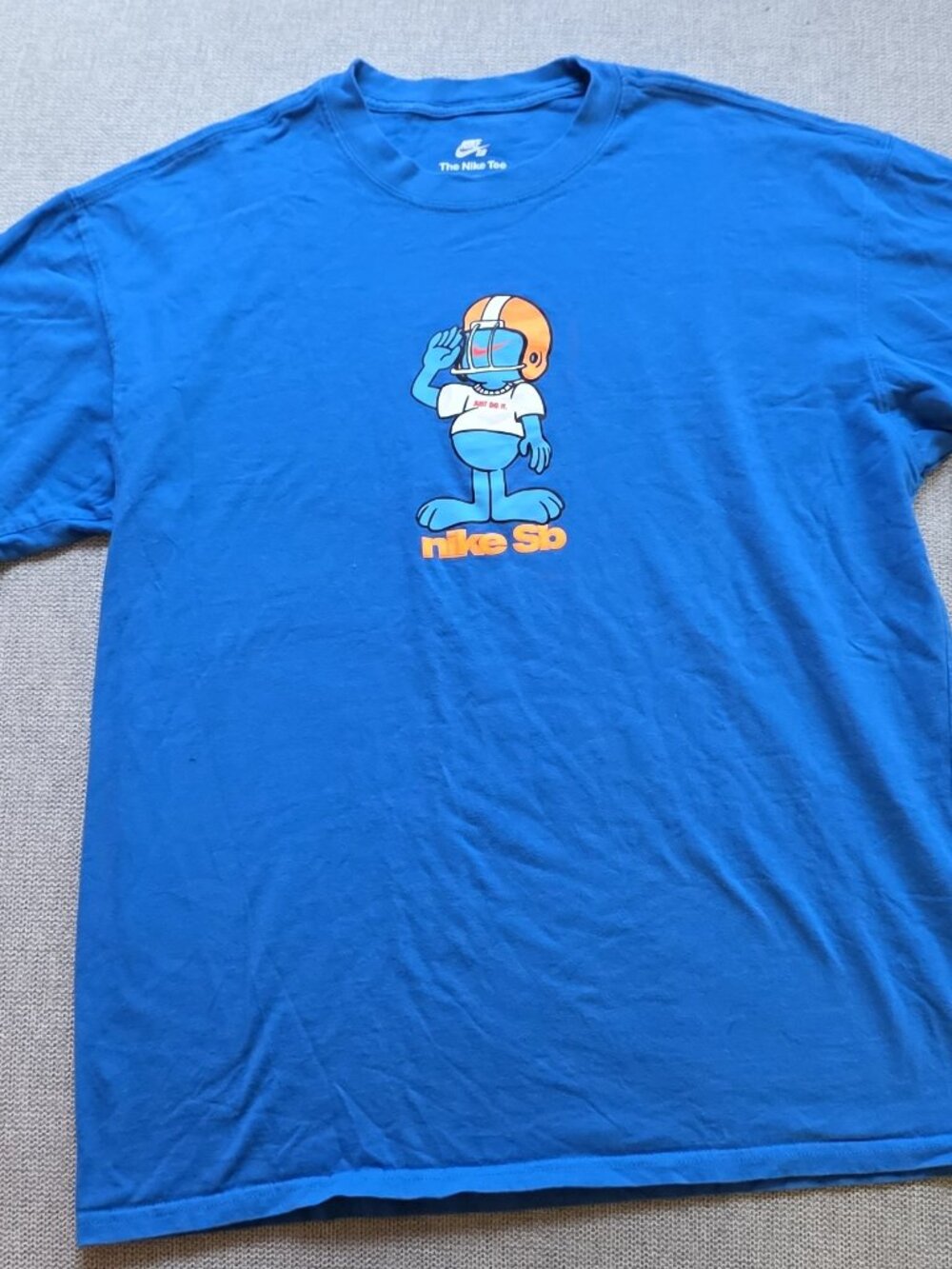 Nike SB "The Nike Tee" Graphic T-Shirt - Blue Football Character Print